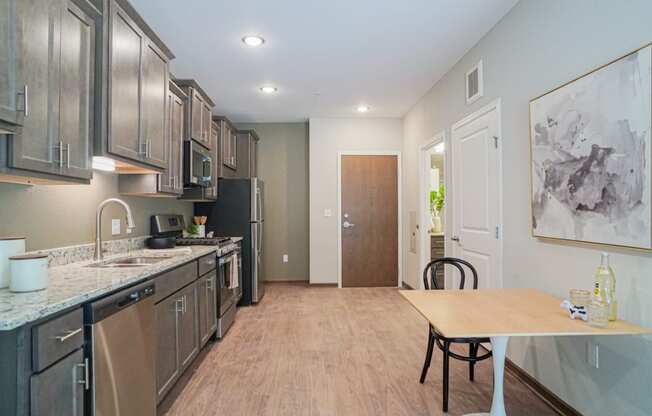 a kitchen and dining area at The Yards and Backyards, Saint Paul, MN