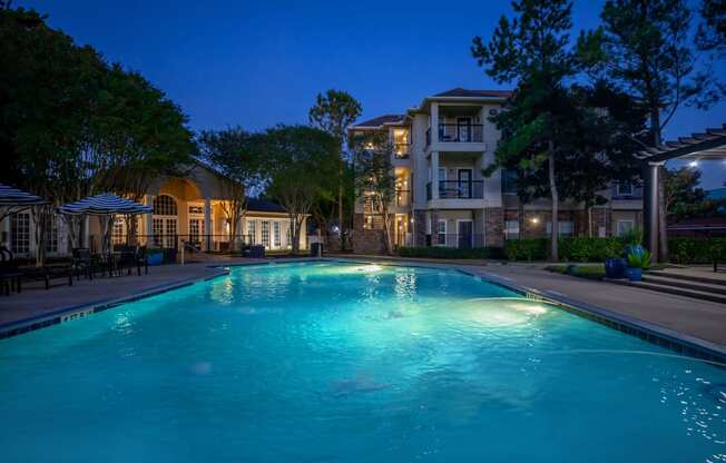 Pet-Friendly Apartments in Houston, TX – Westchase Forest – Photo of the swimming pool at night at the preserve at polk apartments