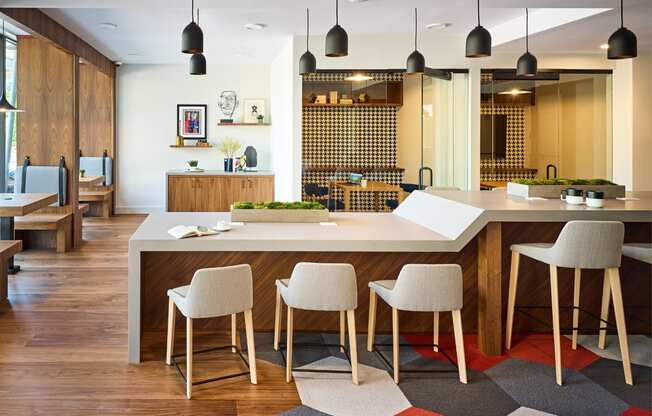 a large kitchen with a large island and chairs in front of it at Dey & Bergen, New Jersey, 07029