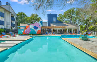 a swimming pool with a building in the background