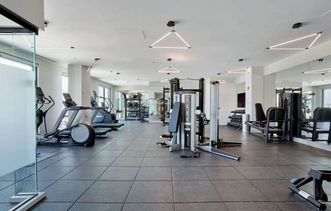 a gym with treadmills and other exercise equipment at Platform 4611, Illinois
