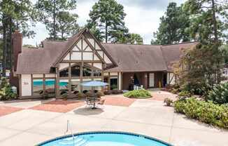 A house with a pool in the backyard.