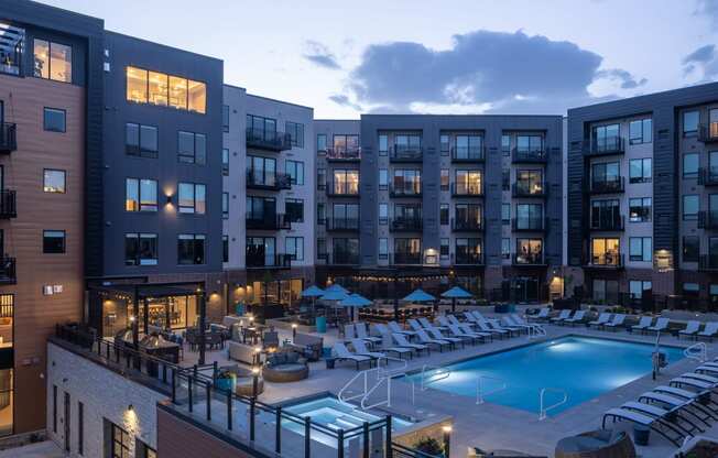 night shot of pool at centennial apartments