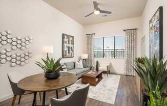 a living room with a round table and a couch