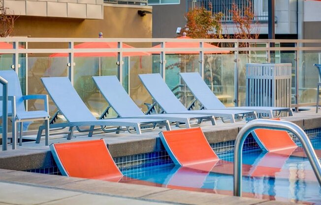Sparkling Swimming Pool with sitting area in the pool at Element 31 Apartments, Utah