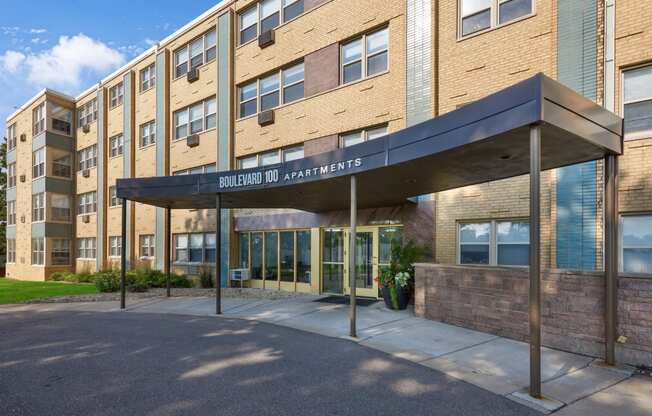 a brick building with an awning and the entrance to solstice dc apartments