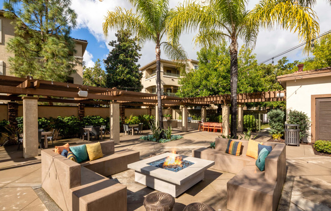 Courtyard with couches and a fire pit