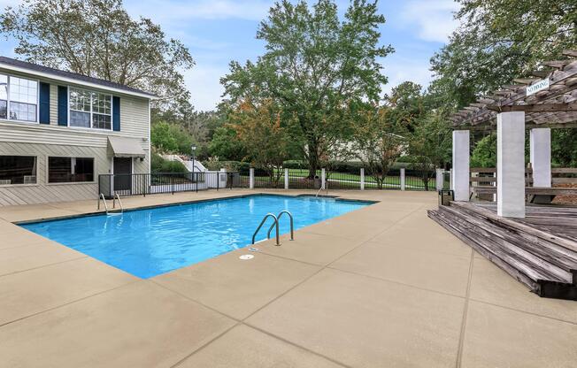 a house with a pool outside of a building