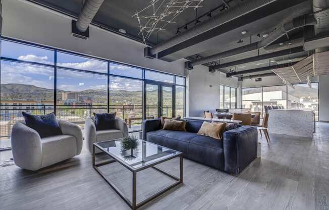 a clubroom with couches and chairs and a table