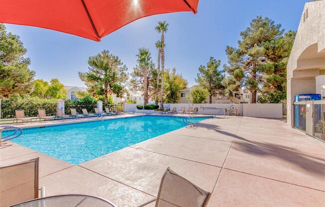 Resort pool umbrella at Country Club at Valley View Senior Apartments in Las Vegas, NV, For Rent. Now leasing 1 and 2 bedroom apartments.