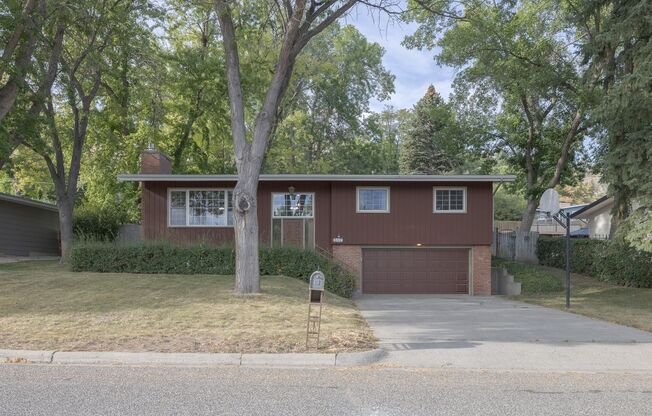Charming 4-Bedroom Split-Level Home with Spacious Yard and Modern Comforts