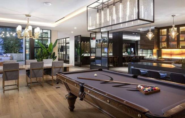 Gaming area with billiards leading to outdoor lounge areas
