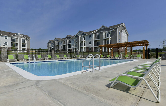 Pool with W-F- and Chaise Lounge Chairs at Dodson Pointe Apartment Homes, Rogers, AR
