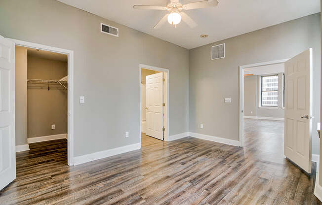 Spacious bedroom with walk in closet and hardwood style flooring