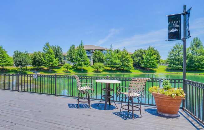 Lake doc with bistro tables and chairs at Cypress Lake at Stonebriar in Frisco, TX!