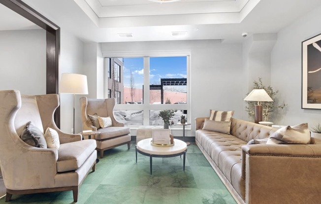 a living room with couches chairs and a coffee table