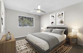 a bedroom with a bed and a ceiling fan