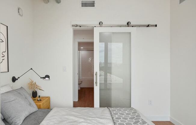 Model bedroom with barn-style sliding door