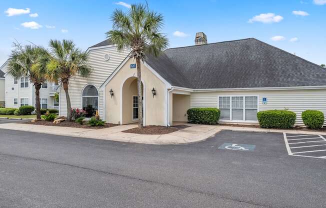 A building with a parking lot in front of it.