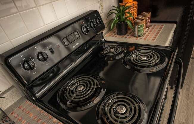 the stove in the kitchen is clean and ready to use