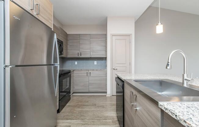 a large kitchen with stainless steel appliances