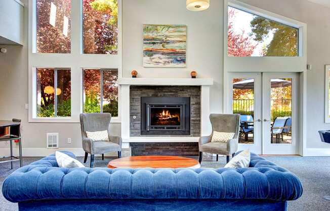 The Reserve at Bucklin Hill clubhouse with sofa and fireplace