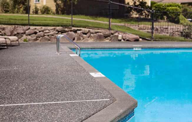 A pool with a 3 feet depth marker.