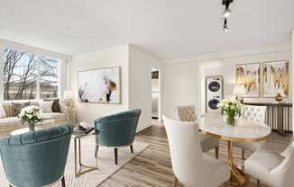 a living room and dining room with white chairs and a table