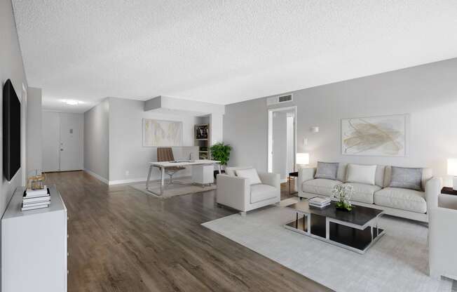 our apartments offer a living room and dining room with white furniture