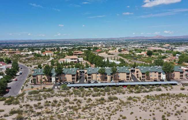 A bird's eye view of a residential area with houses and a road.