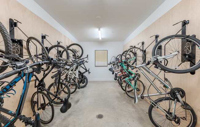 A bike rack with many bikes parked.