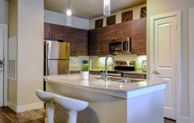 spacious kitchen with stainless steel appliances at The Allure luxury Cedar Park, TX apartments