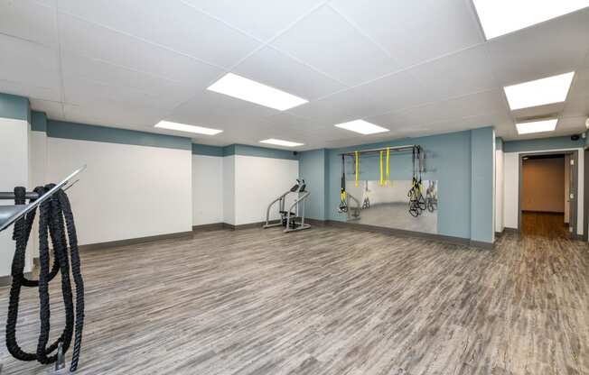 a fitness room with  weights