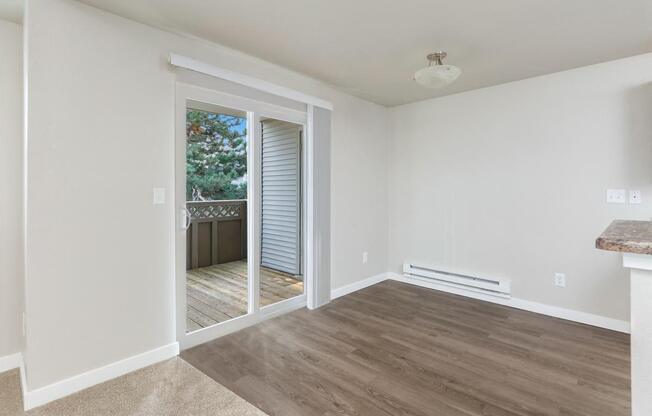 A room with a door leading outside.