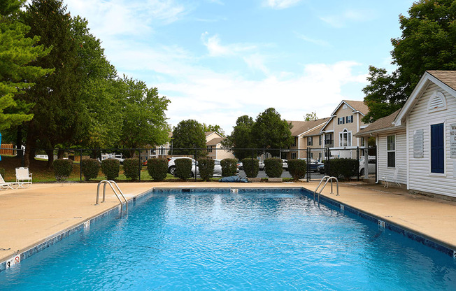 swimming pool with apartments in the background