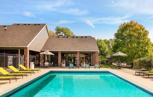 Outdoor pool with lounge chairs at Eden Commons in Eden Prairie, MN 55344