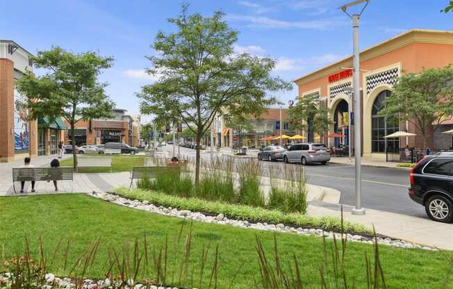 a rendering of a park in front of a shopping center