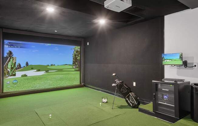 Virtual golf simulator in gaming lounge