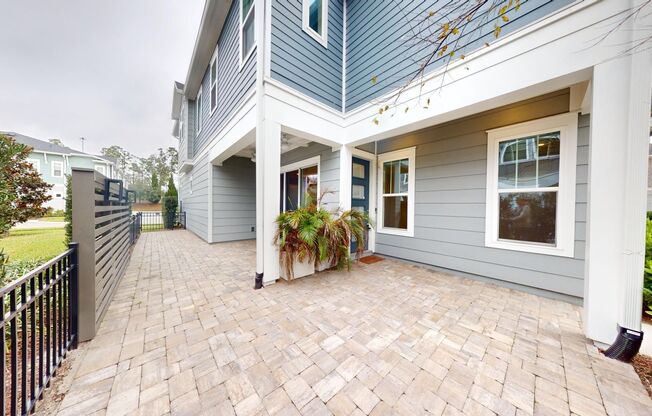 Single-family Courtyard Home nestled within David Weekley's exclusive enclave of Tidal Pointe!