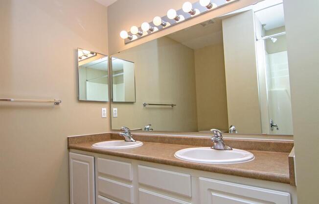 Master Bathroom with dual sinks and white cabinetry at Cascade Pines Duplex Homes in Lincoln NE
