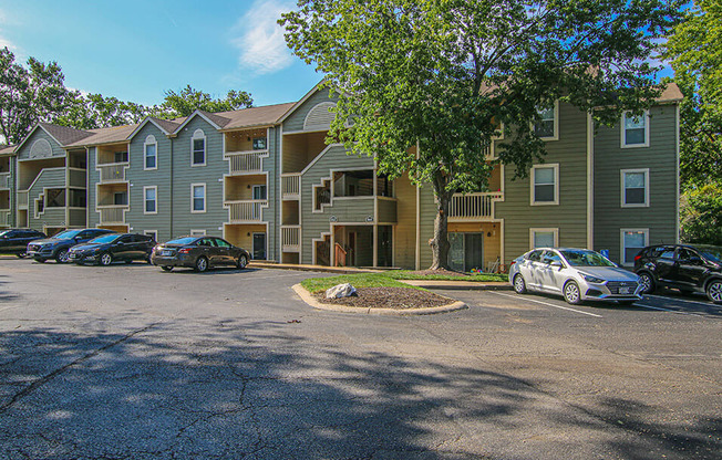 a parking lot in front of an apartment complex