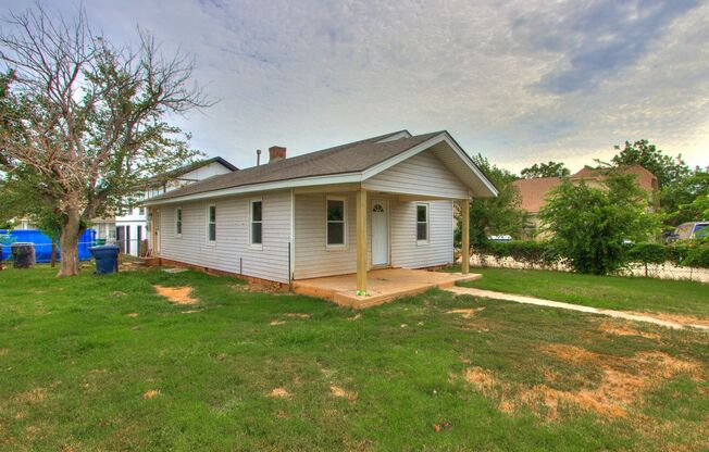 Stylishly Remodeled 2-Bedroom Home with Spacious Fenced Backyard and Gorgeous Green Kitchen Cabinets!