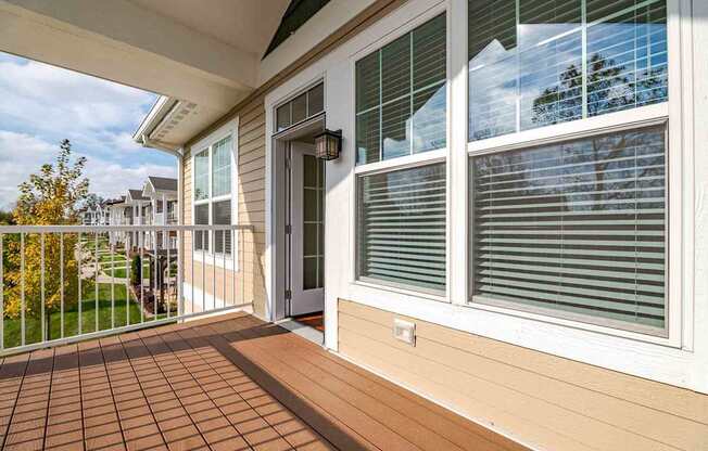 A patio with a door and a window.