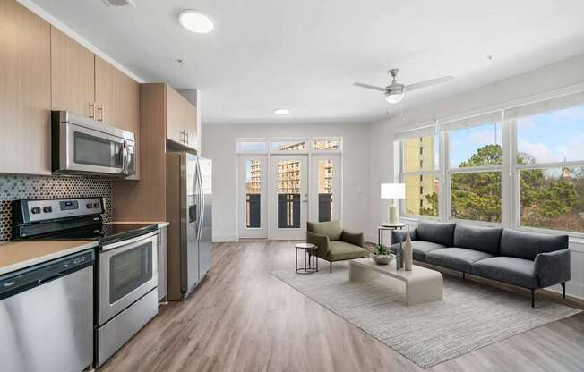 A modern kitchen with wooden cabinets and stainless steel appliances.