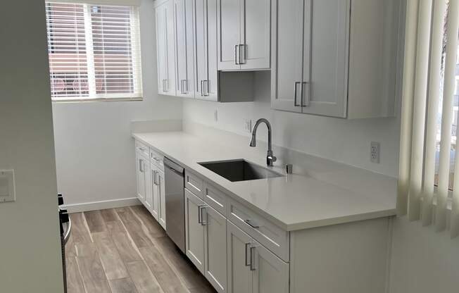 Kitchen with Stainless Steel Appliances and White Cabinets