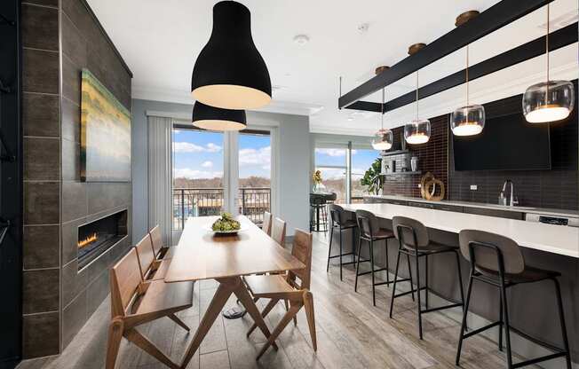 A modern kitchen with a dining table and chairs.