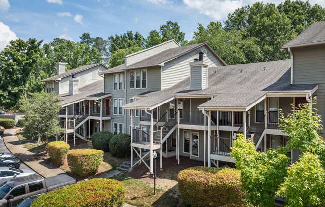 an aerial view of the apartment complex with a parking lot