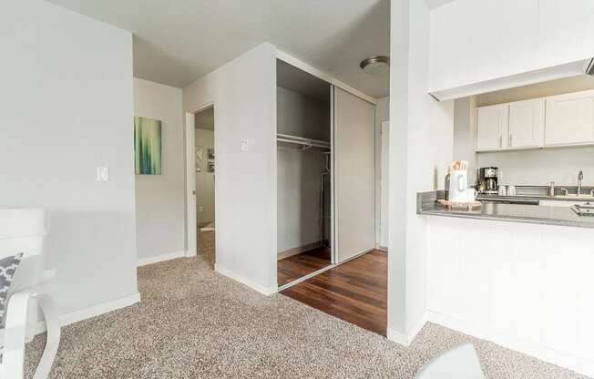 Renton Apartments - The Aviator Apartments - Hallway, Closet, Entryway, Living Room, Bedroom, and Kitchen