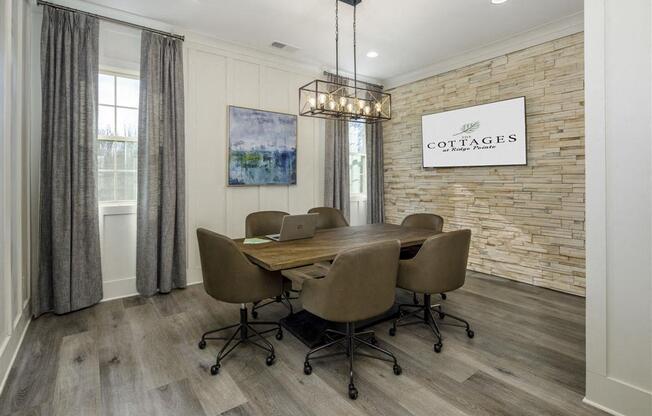 a dining room with a table and chairs and a brick wall