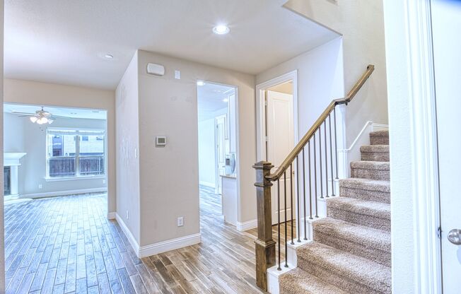 Luxury Sun-Drenched End-Unit Townhouse Offering Effortless Upscale Living in the Heart of Plano!